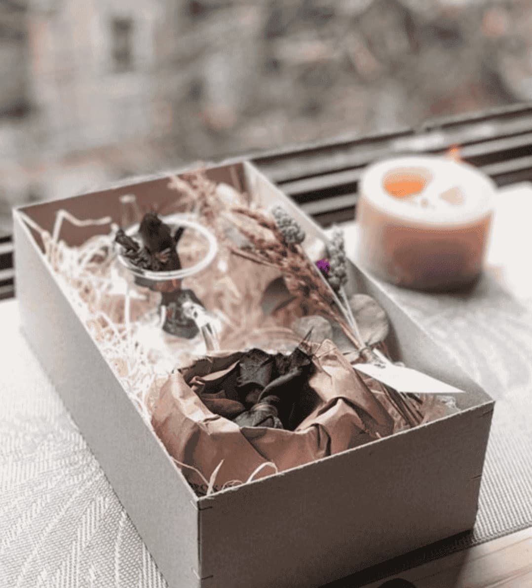 Gift Experiences — Curated boxes with flowers at the centre